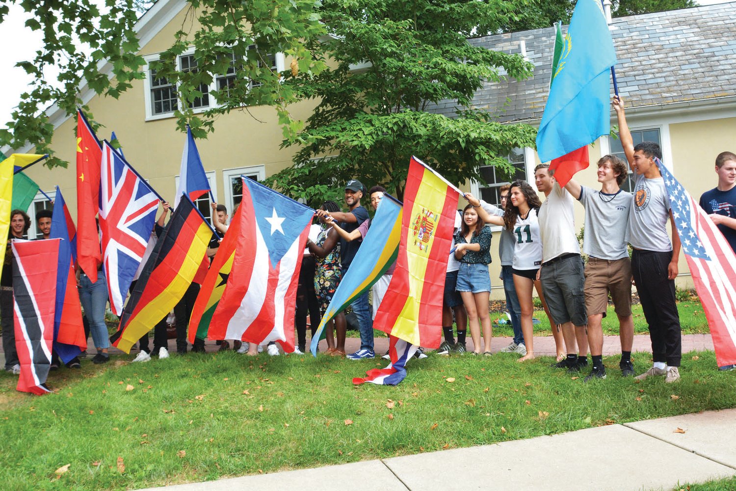 Solebury students line up with 21 flags that represent their home country or their parents’ home country.  Photograph by Kelli Abdoney
