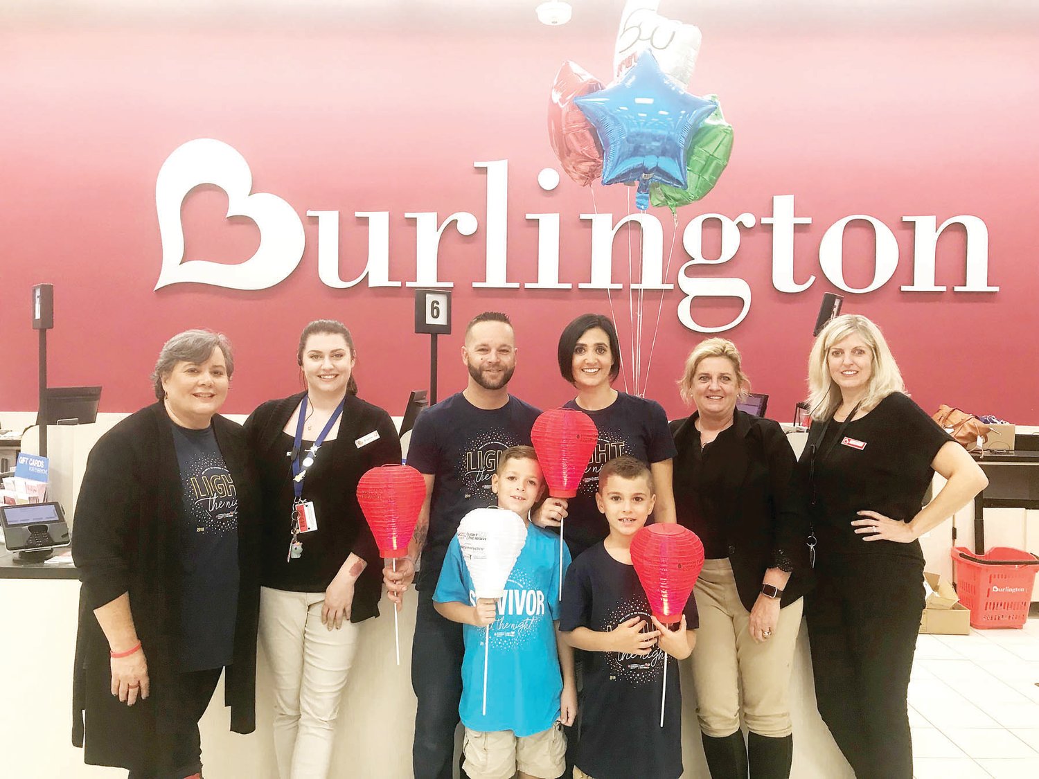 Garrett Adams, 8, a student at J.M Grasse Elementary School in Sellersville, went on a $100 shopping spree Oct. 11 courtesy of the Leukemia & Lymphoma Society and Burlington Stores in Hatfield. Garrett, seen wearing a survivor T-shirt, was diagnosed with leukemia after his second birthday and has been in remission for two years.