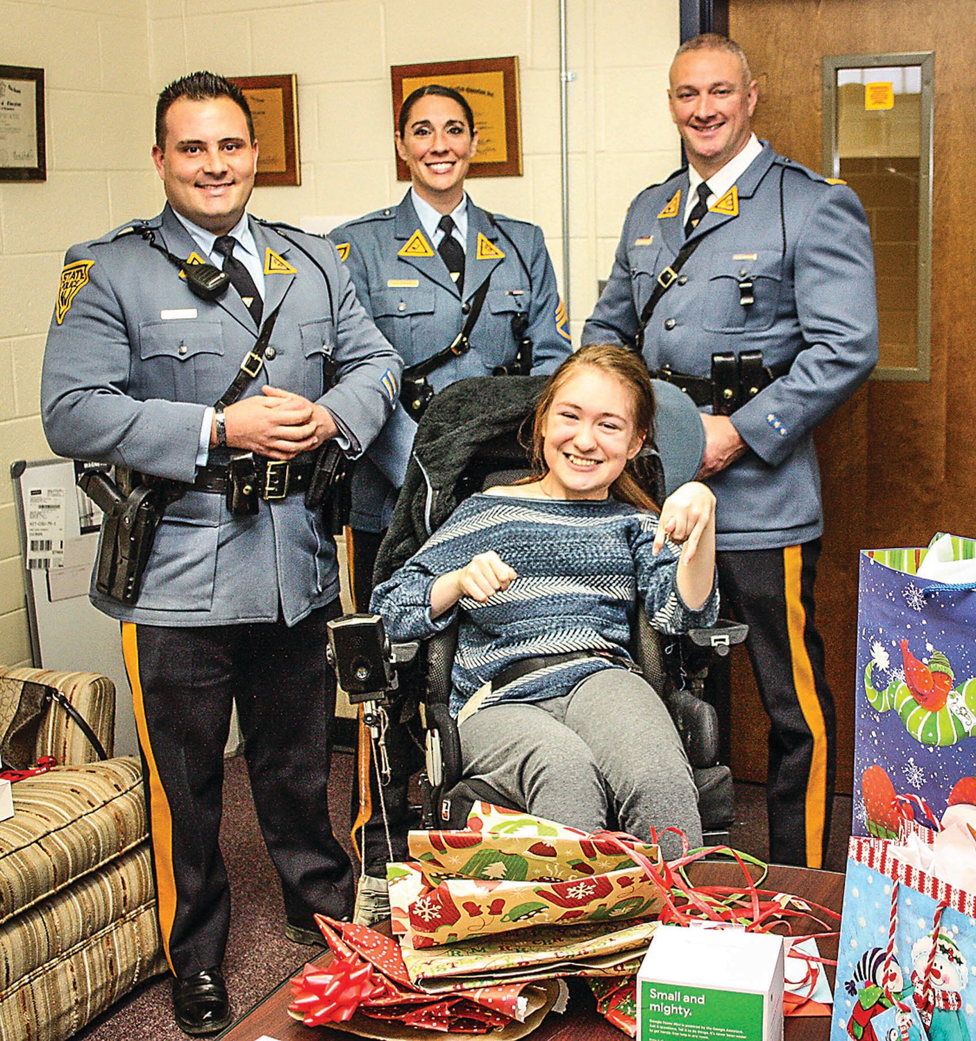 Faith Scott, a Del Val High School junior, was delighted by a shower of gifts presented to her by this delegation from the state police stationed in Kingwood, N.J. They are, from left, Trooper Joe Seidler, Sgt. Jaclyn Jirus and Lt. Sean O’Connor.