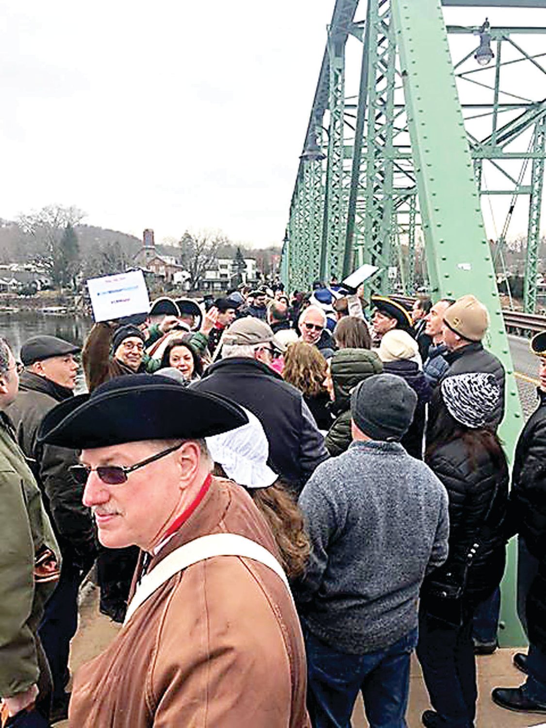 Pub crawl participants gather at Lambertville-New Hope free bridge. Photograph by Jen Samuel.