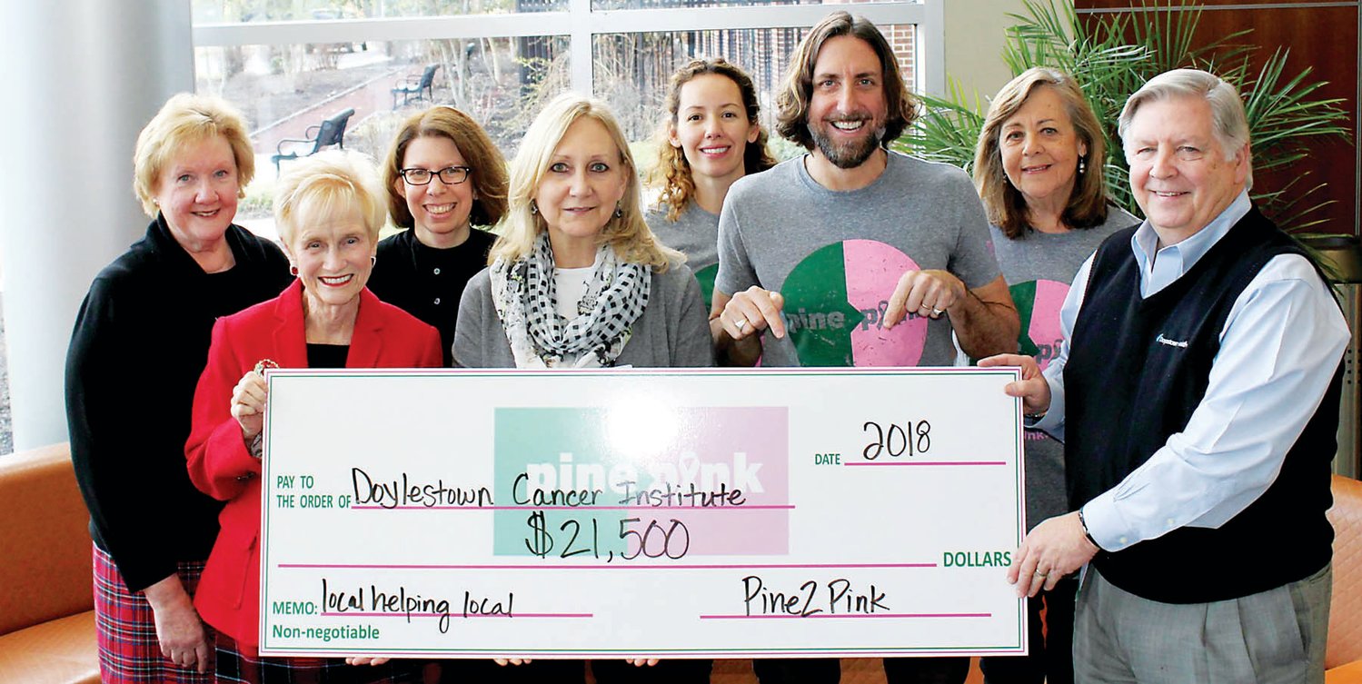 At the Pine2Pink check presentation are Cathy Benner, director, Doylestown Health’s Cancer Institute; Joan Parlee, chairman of the board, Doylestown Health; Rachel Saks, oncology social worker, Doylestown Health’s Cancer Institute; Dr. Donna Angotti,  Doylestown Health breast surgeon; Kristina Fenimore, Keith Fenimore and Marianne Fenimore, and James Brexler, president and CEO of Doylestown Health.