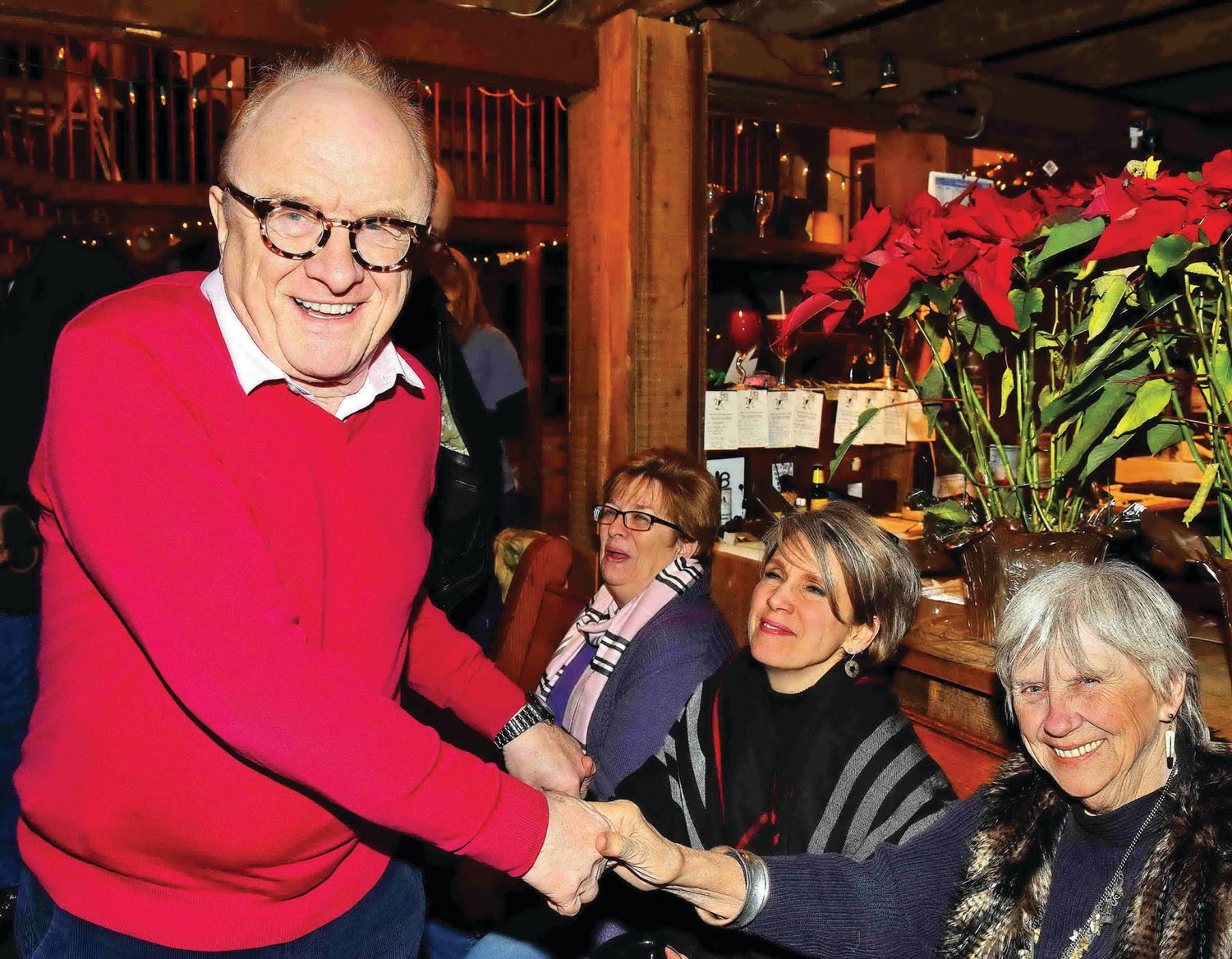 Singer Peter Asher shakes hands with Cynthia Wuthrich at the pre-concert meet and greet. Photograph by Gordon Nieburg