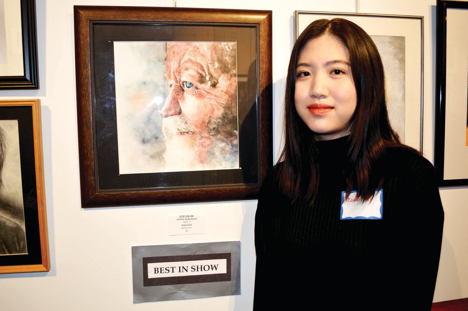 Soeun An, a senior at Upper Dublin High School, with her Best in Show winner, “Ageless,” a watercolor.