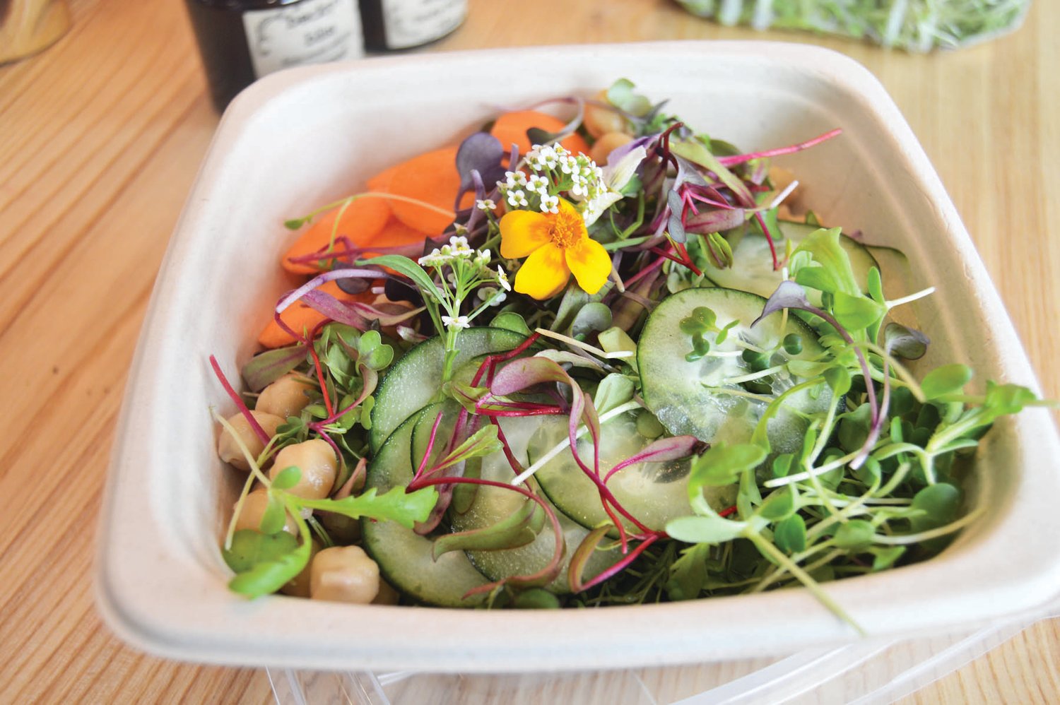 A microgreen salad using produce from Blue Moon Acres in Buckingham is just one item on an extensive menu that includes juices, smoothies, waffles, coffees and juice cleanses.