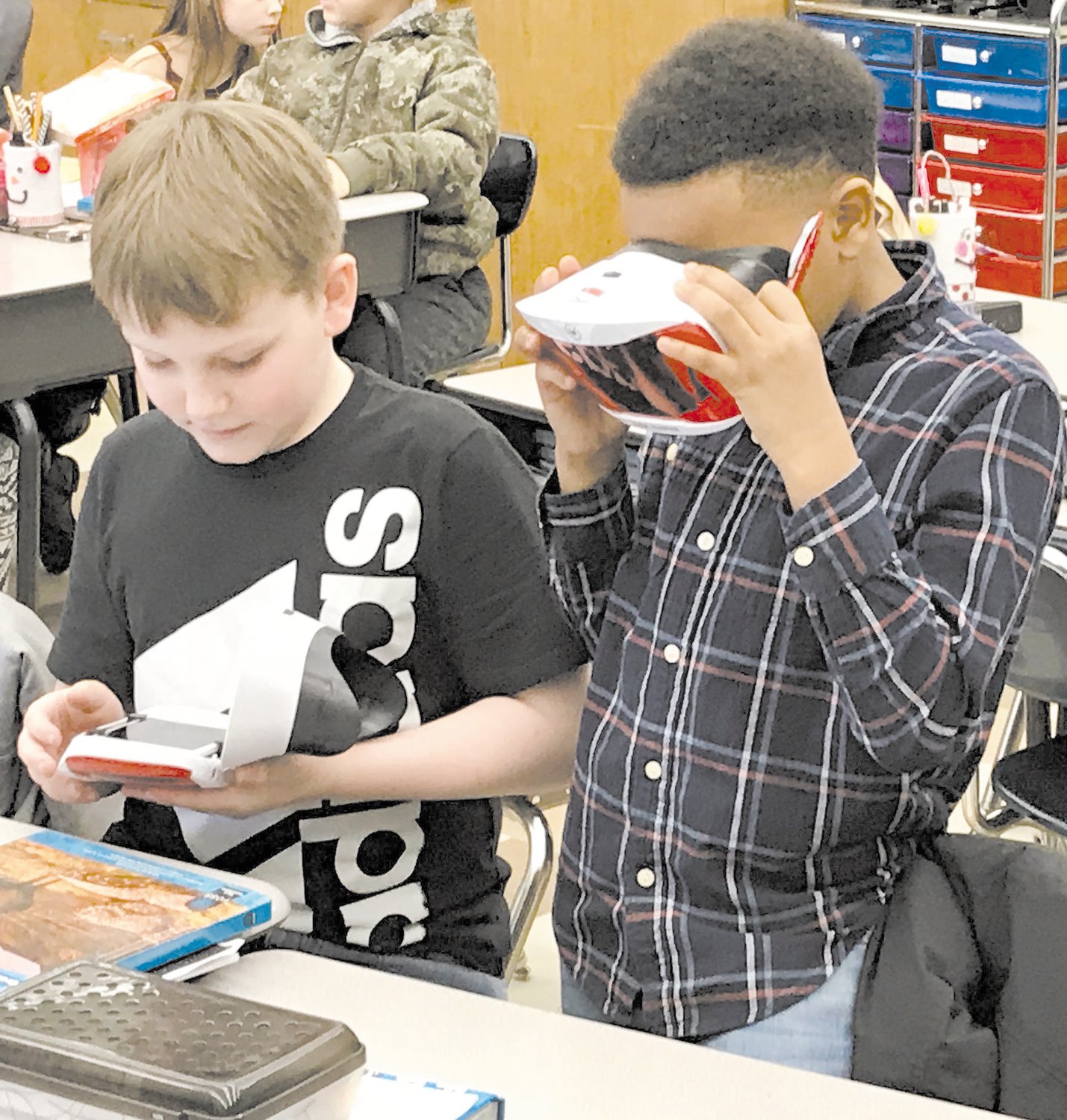 Students in Ryan Wieand’s fourth-grade class at Quakertown Elementary School use Google Expeditions Virtual Reality headsets during a lesson.