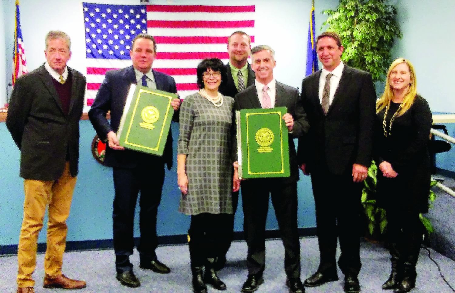 From left are Falls Township Supervisors Brian Galloway, Vice Chairman Jeffry Dence, Jeff Boraski, Chairman Bob Harvie and Jeff Rocco, along with Recorder of Deeds Robin Robinson, center, and Robinson’s First Deputy, Gail Humphrey.