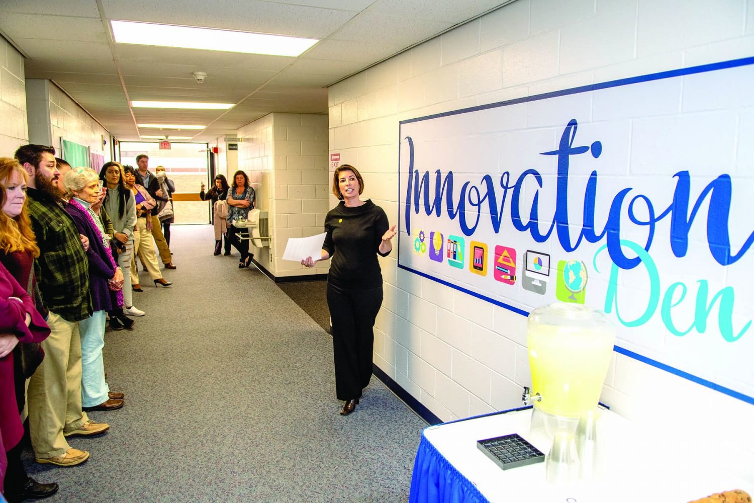 Tracy Timby, dean of the newly renamed Business + Innovation Department at Bucks County Community College, shows off the entrance to the new Innovation Den in Grupp Hall on the Newtown Campus.