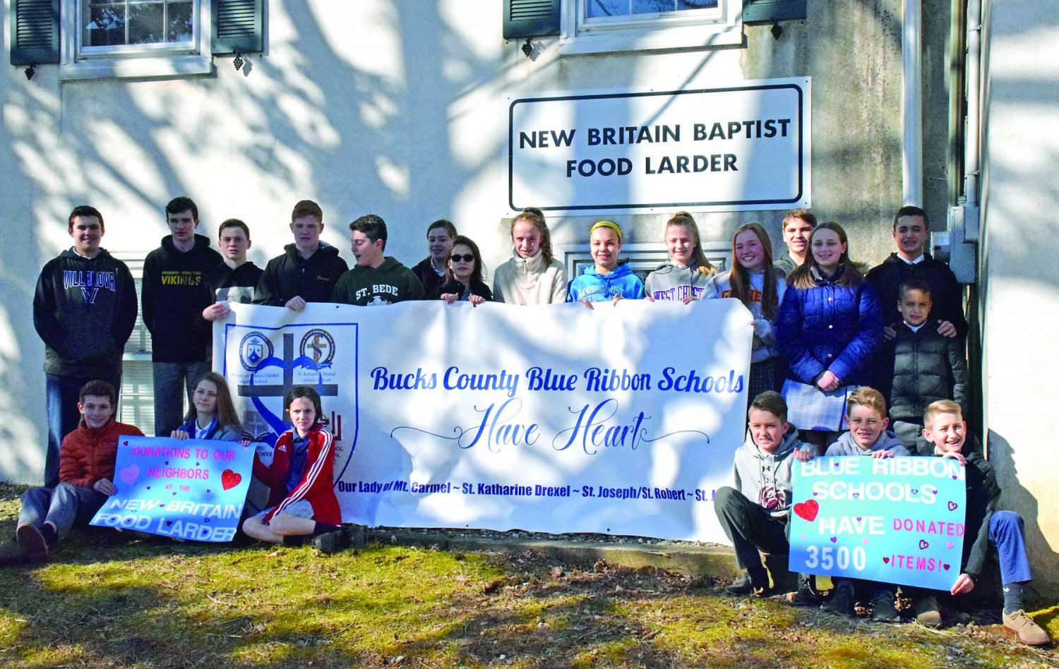 Students from four Blue Ribbon schools – Our Lady of Mount Carmel School in Doylestown, St. Katharine Drexel in Holland, St. Joseph/St. Roberts in Warrington, and St. Jude in Chalfont – participate in a food drive for the New Britian Food Larder. Photograph by Debby High.