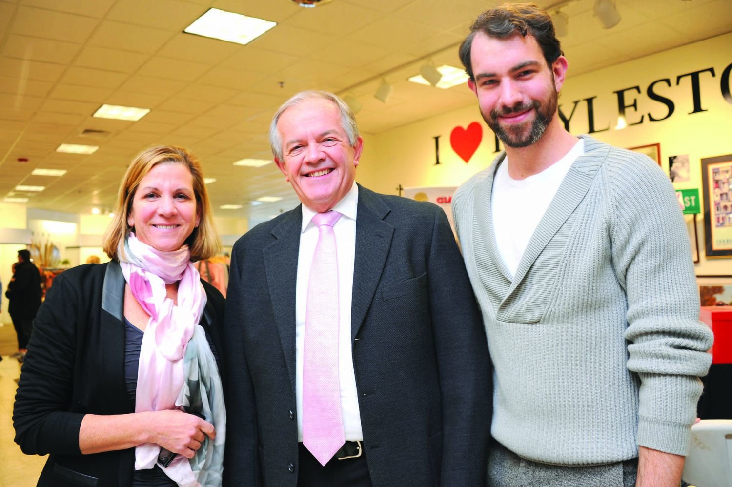 Karen Thompson, left, with Mayor Ron Strauss of Doylestown and her son Kerry at a celebration for the Pine2Pink nonprofit in the newly opened Fox and Holly store last fall. LSL Brands, the Thompson string of shops, took over the Bon-Ton space as a pop-up and is continuing as a permanent resident. The company donates funds for many nonprofits through the year. Photograph by Carol Ross.