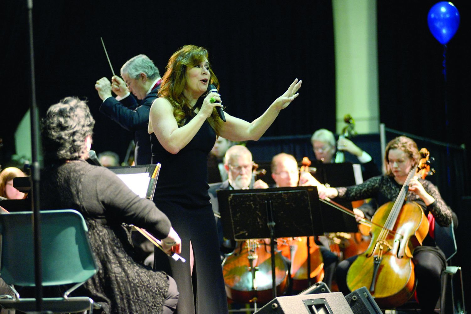 Debbie Gravitte sings as Music Director Gary S. Fagin, conducts the Bucks County Symphony Orchestra. Photograph by Carol Ross.