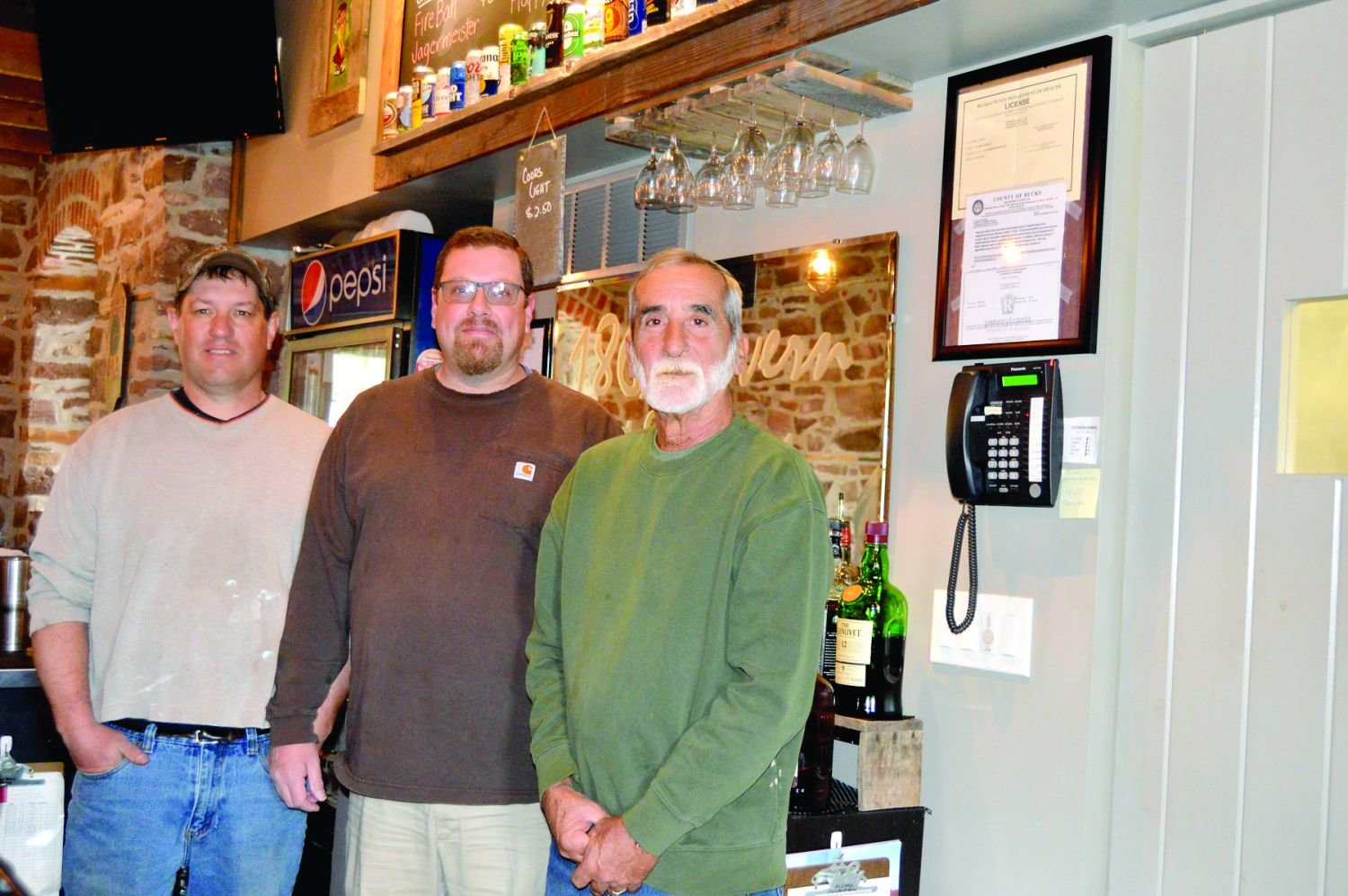 Standing at the bar in the 1863 Tavern at Fairways Golf Club in Warrington are, from left, co-owner Ron Gorniak, bar manager Ryan Ball and chef Wayne Fanelli. Photograph by Susan S. Yeske.