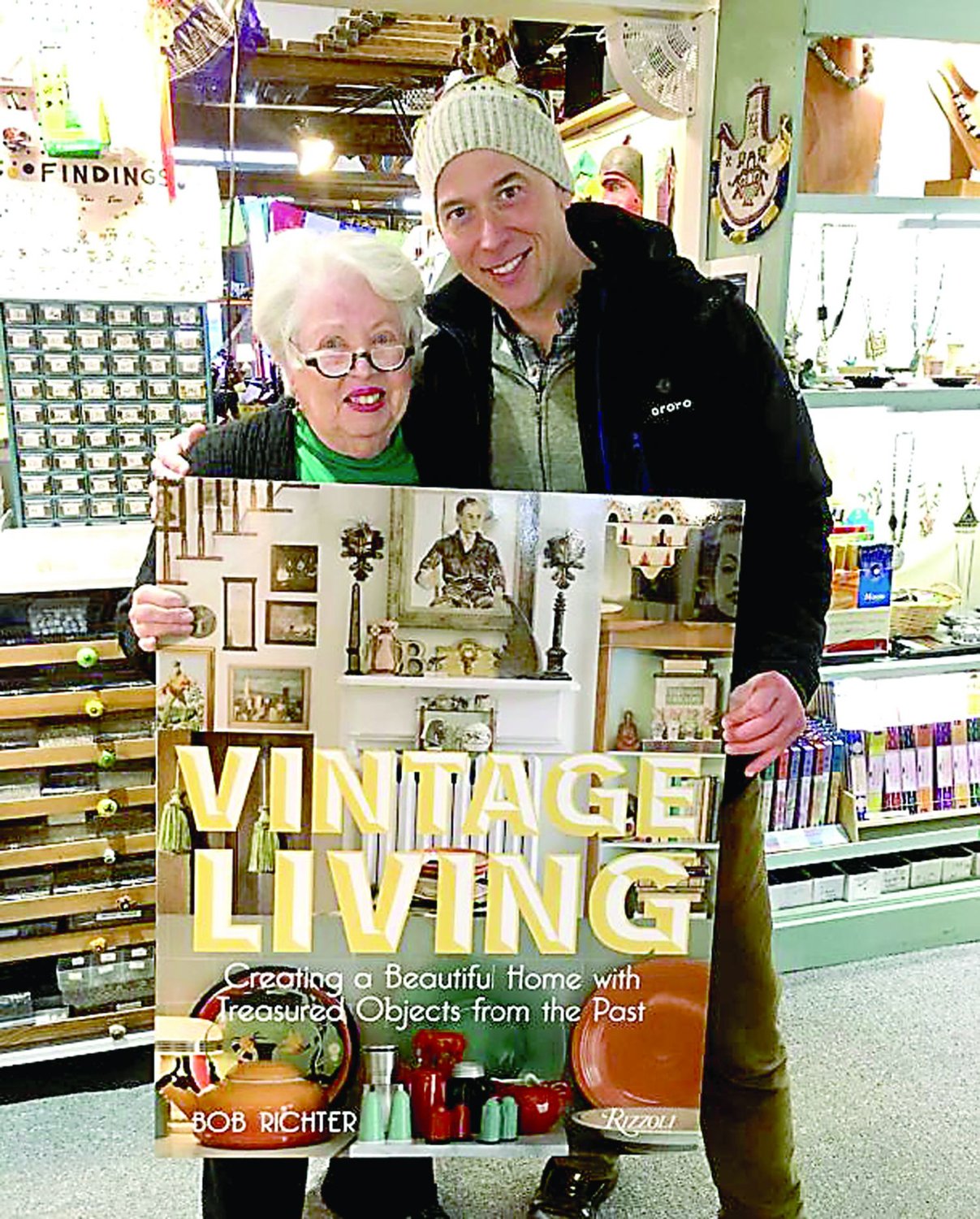 Sojourner co-owner Elsie Coss with Bob Richter celebrating the release of his second book, “Vintage Living.”