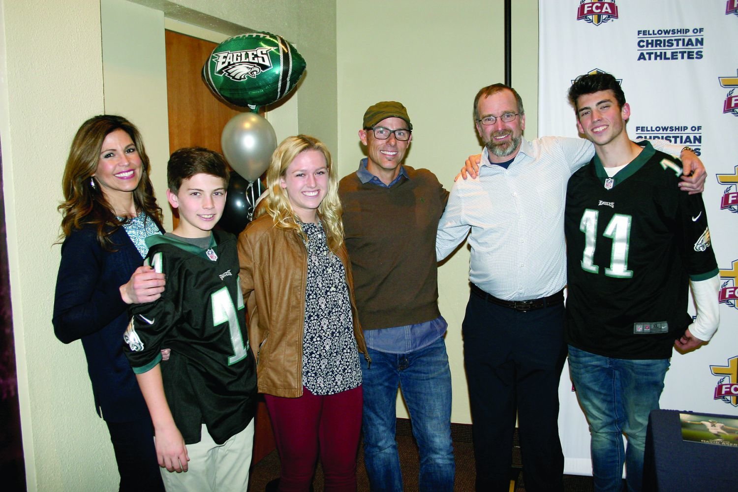 Former Philadelphia Eagles kicker David Akers gathers with the Loving family. CB East alumna Emma Loving, third from left, a junior soccer player at Penn, was one of two student-athletes who spoke at a Fellowship of Christian Athletes event on April 5 at Cairn University.
