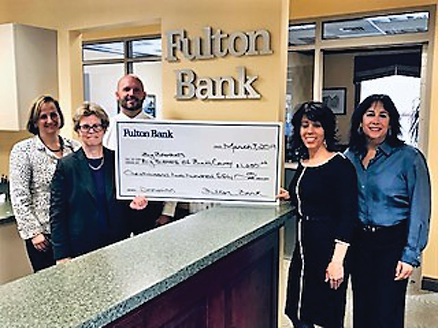 From left are: Sue Lonergan, regional president, Southeastern Pennsylvania; Suzanne Hartshorne, vice president, senior relationship manager; and Louis Lombardi, senior vice president, commercial market executive of Fulton Bank; Rachel Kurtz, owner of RK Abstracts and board member, and Laura Jones, director of development, Big Brothers Big Sisters of Bucks County.