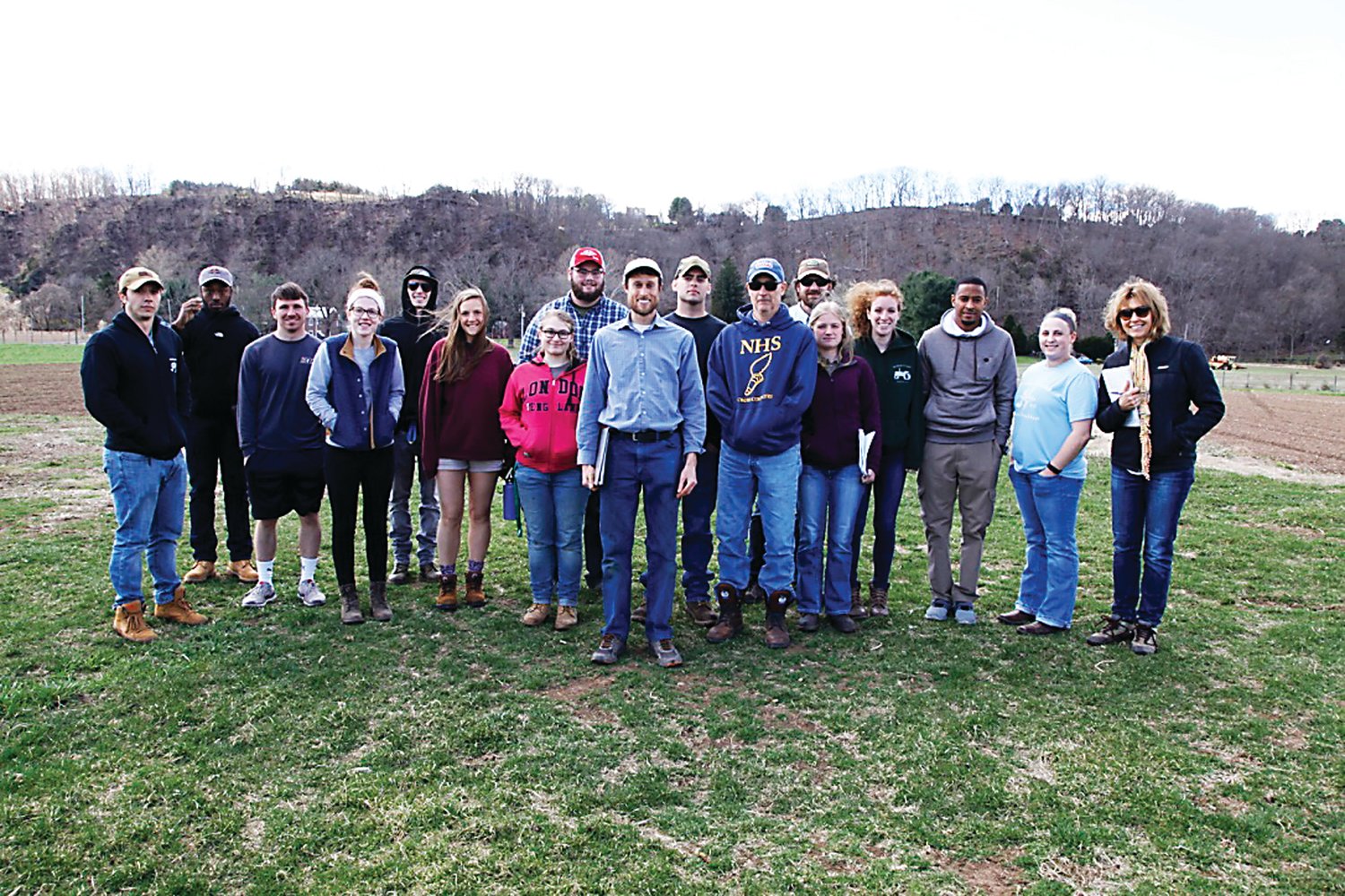 John Crooke, center, with students visiting Tinicum CSA from Delaware Valley University.  Photograph by Chris Ruvo.