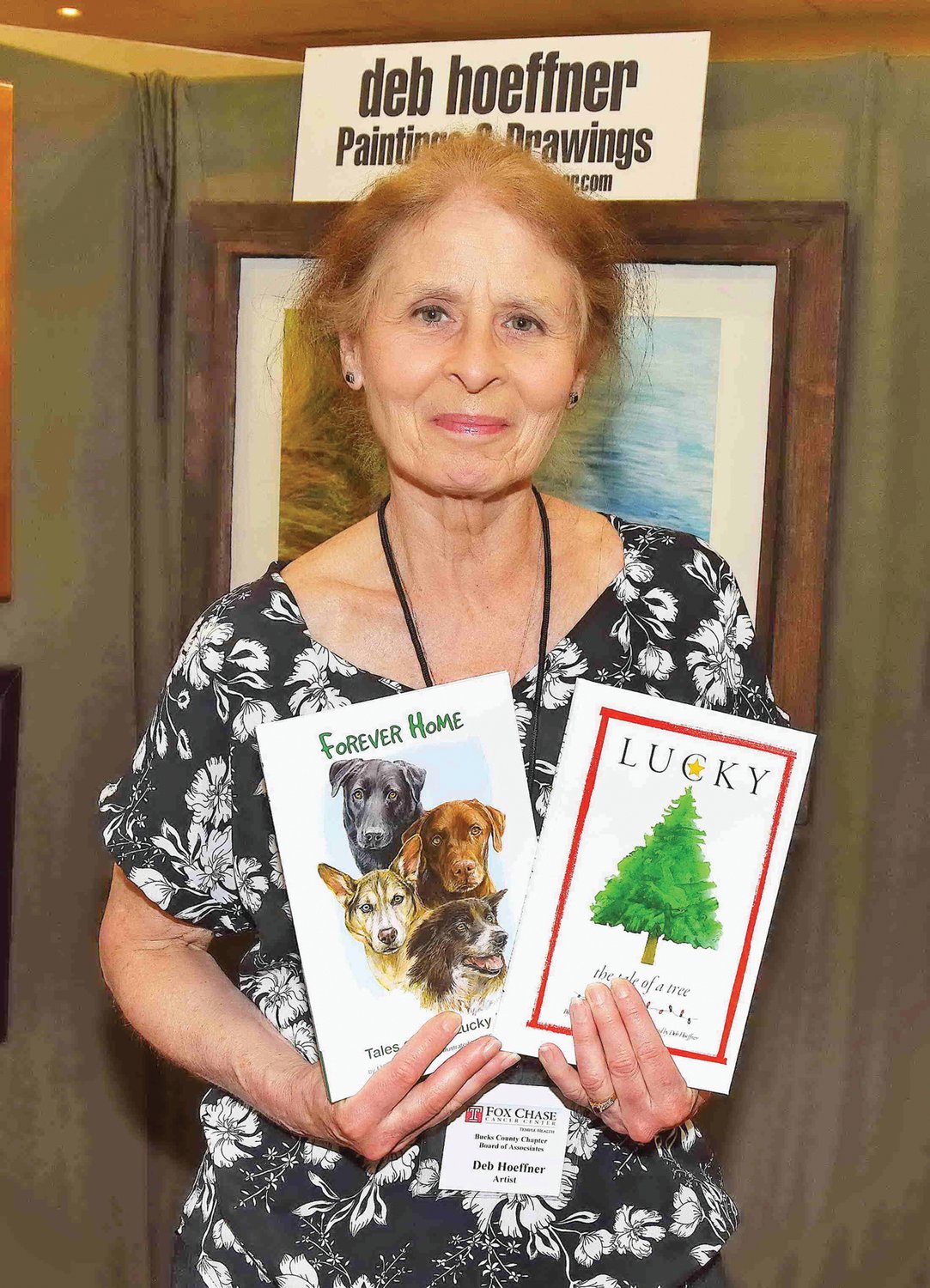 Illustrator Deb Hoeffner holds copies of her books. Photograph by Gordon and Libby Nieburg.