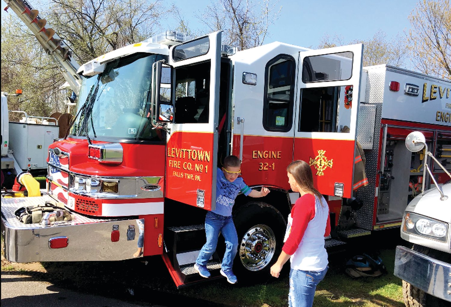 A youngster gets out of a Levittown Fire Co. truck at a prior Touch a Truck event in Falls township.