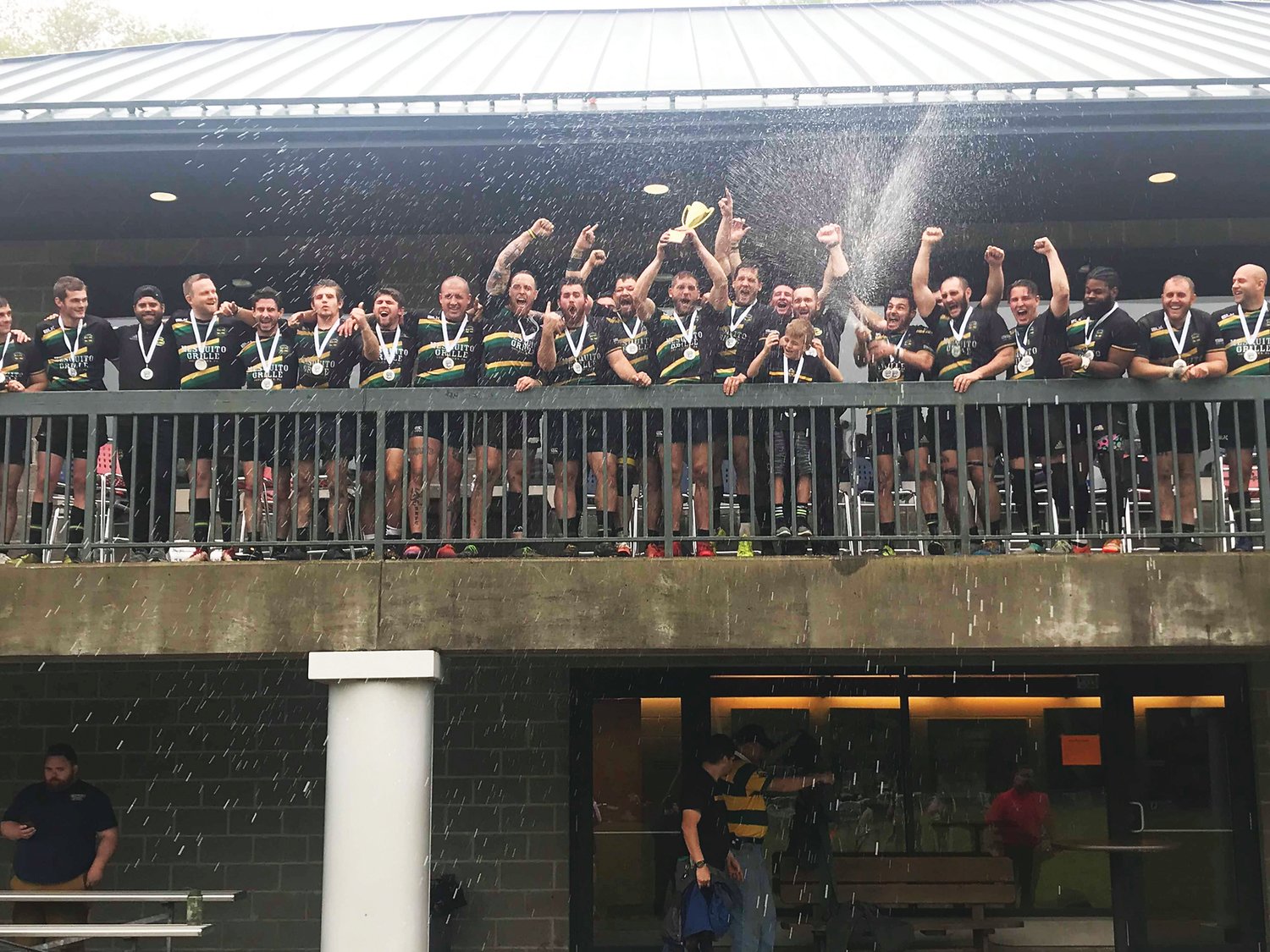 Members of the Doylestown Rugby men’s team celebrate after defeating Raleigh 47-14 May 4 at Founders Field in Pittsburgh for their second consecutive MAC championship.