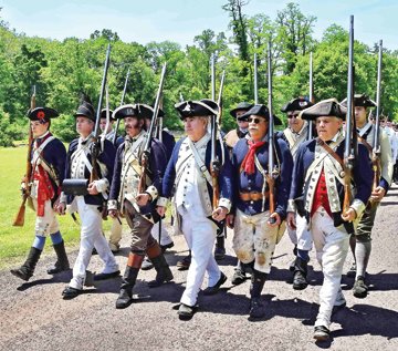 The procession of Revolutionary War re-enactors. Photograph by Gordon and Libby Nieburg.