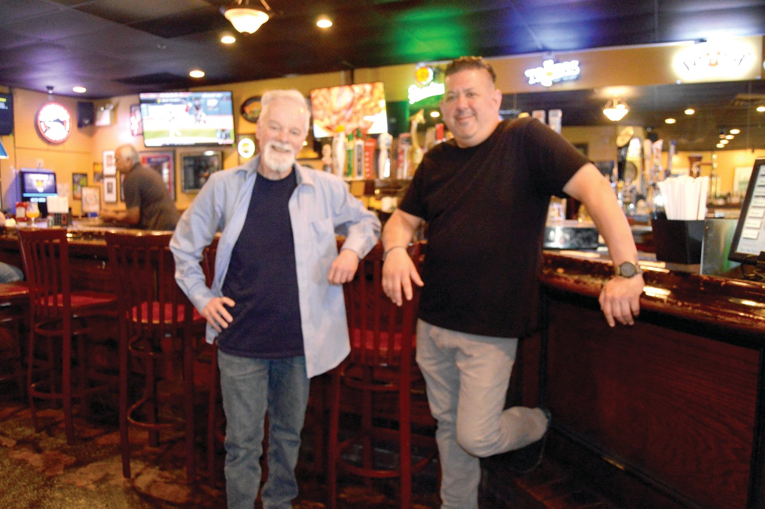 Chris Staub, left, owns the Blue Dog Family Tavern in New Britain with his wife Teri (not shown). At right is manager Rob Hyde.