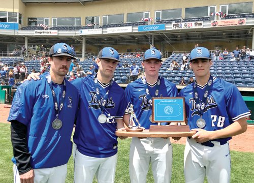 From left: CB South coach Brian Klumpp, Ryan Rieber, Joey Loynd and Jake Trachtenberg stand with the PIAA Class 6A runner-up trophy.