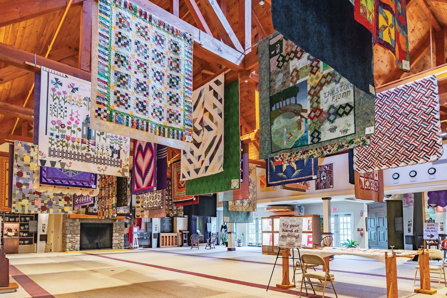 Quilts hang from the rafters at the Bucks County Visitor Center in Bensalem during the 2018 Bucks County Quilt Show. This year’s event begins June 30.