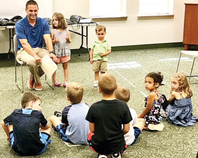 Principal Dr. Michael Zackon speaks with soon-to-be first graders at the Quakertown Library.
