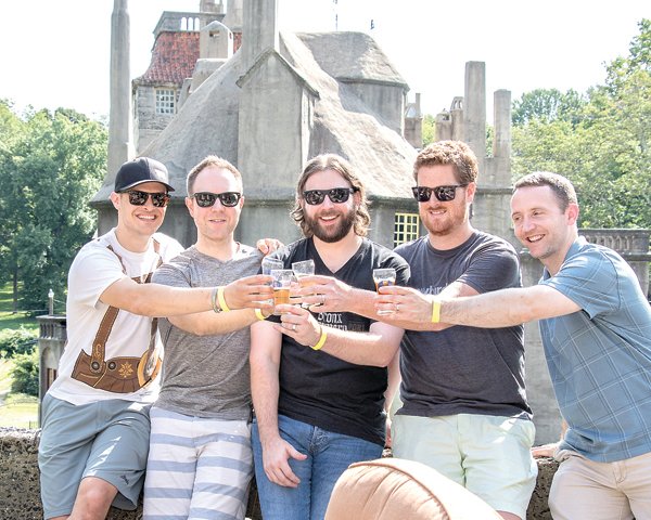 Friends make a toast at a previous Fonthill’s Beer Fest. This year’s event is set for late August.