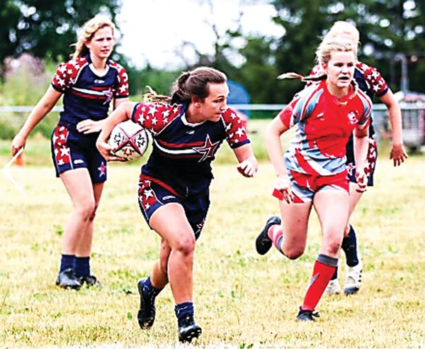 Doylestown Rugby Academy’s Nina Mason carries the ball while playing for the Stars in the Great North 7s Tournament in Toronto.