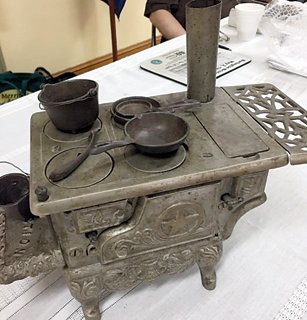 This salesman’s sample of an antique iron stove complete with utensils was valued at about $500.