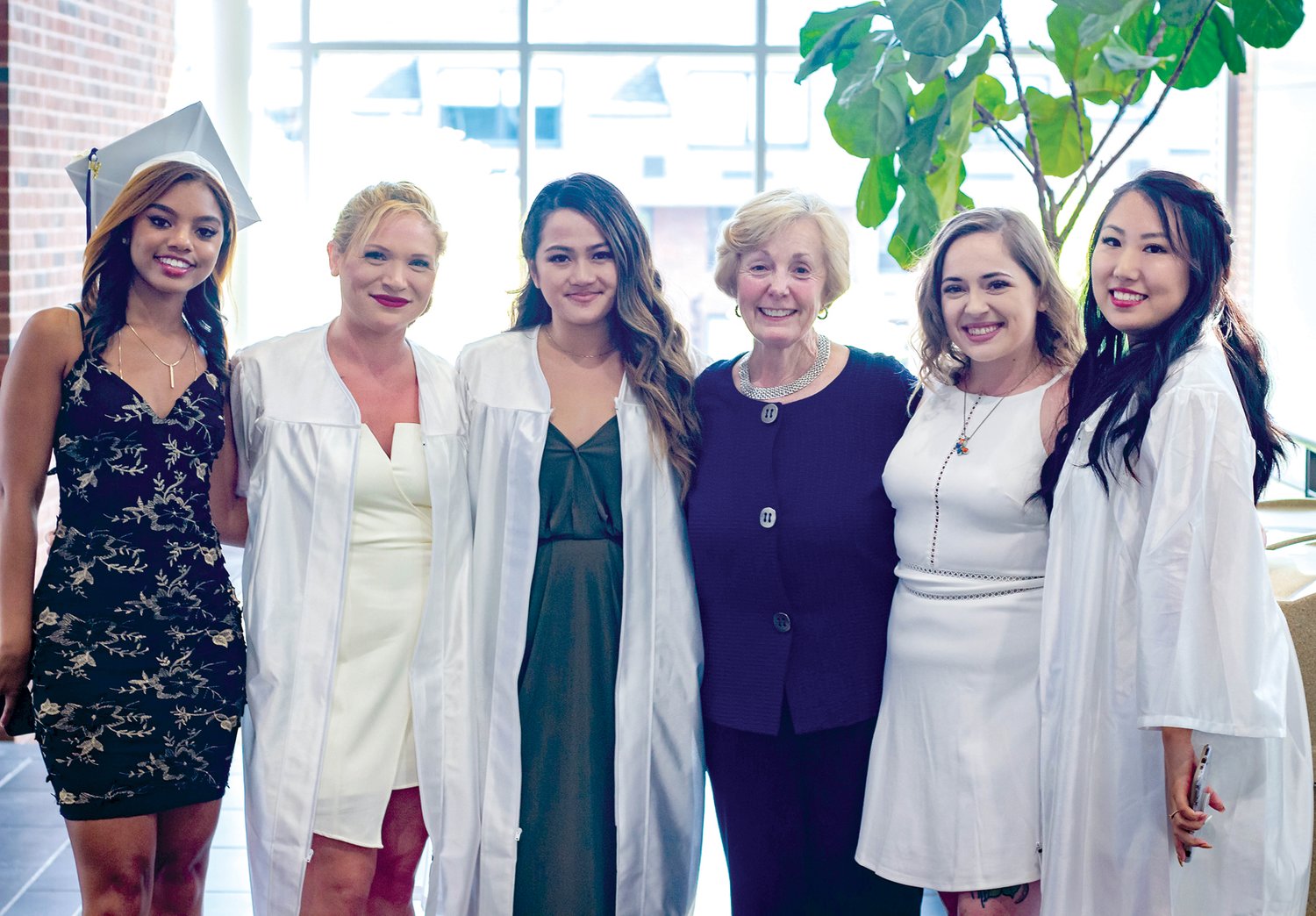 Several graduates of Bucks County Community College’s top-ranked practical nursing program gathered to thank one of their instructors just before their June 28 graduation ceremony at the Newtown campus. They are, from left, Sierra Thomas of Levittown, Anna Muncy of Southampton, Winnie Chung of Bensalem, instructor Elizabeth Franco, Joanna Sharpe of Bensalem, and Noel Han of Philadelphia.