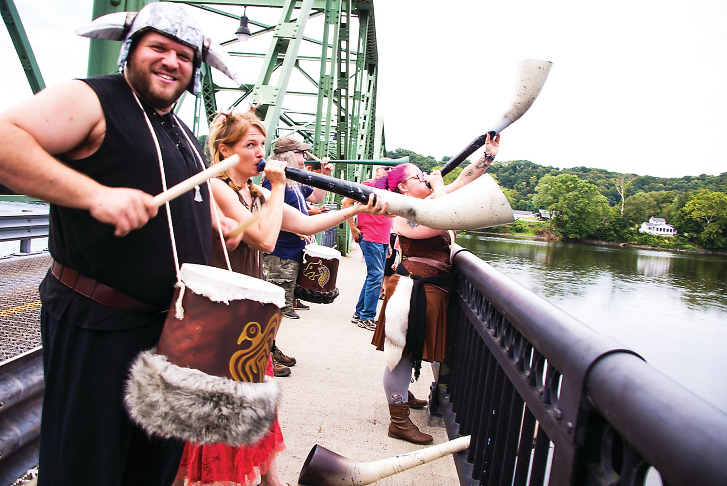 The Frenchtown Vikings sound the horns and beat drums atop of the Frenchtown bridge to start Riverfest. Photograph by Chiara Chandoha.