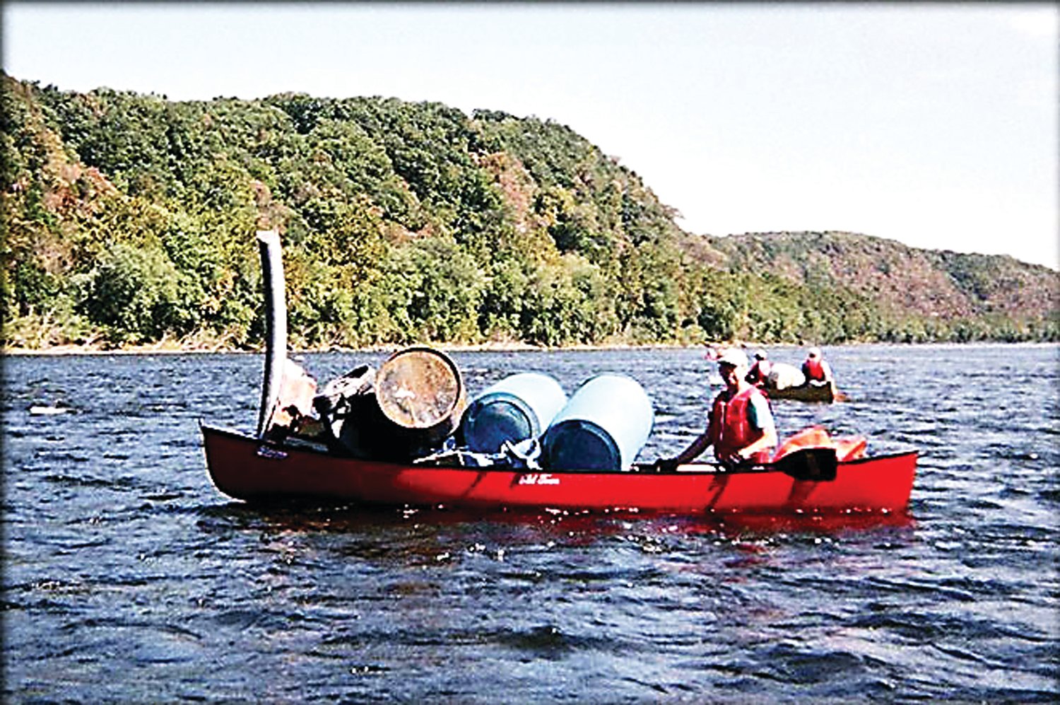 A canoe carries debri discovered in last year’s river cleanup.