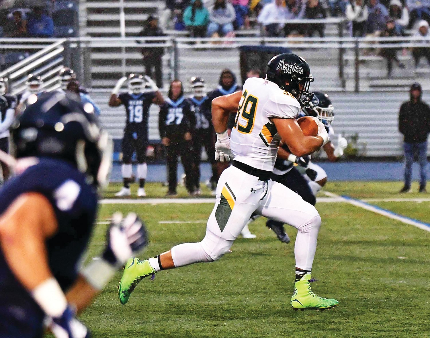 Delaware Valley University fullback Nate Pauls races past a pair of Kean defenders for a 50-yard, first-quarter touchdown reception Friday night in the Aggies’ 37-7 season-opening victory. Photograph by Chuck Greco