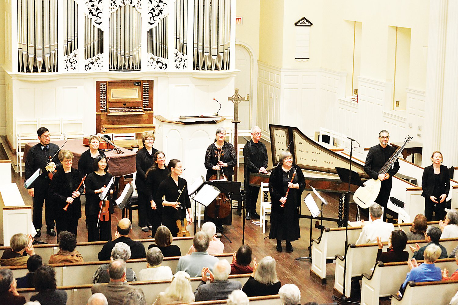 Dryden Ensemble, shown at the conclusion of a prior concert, celebrates its 25th season this year.