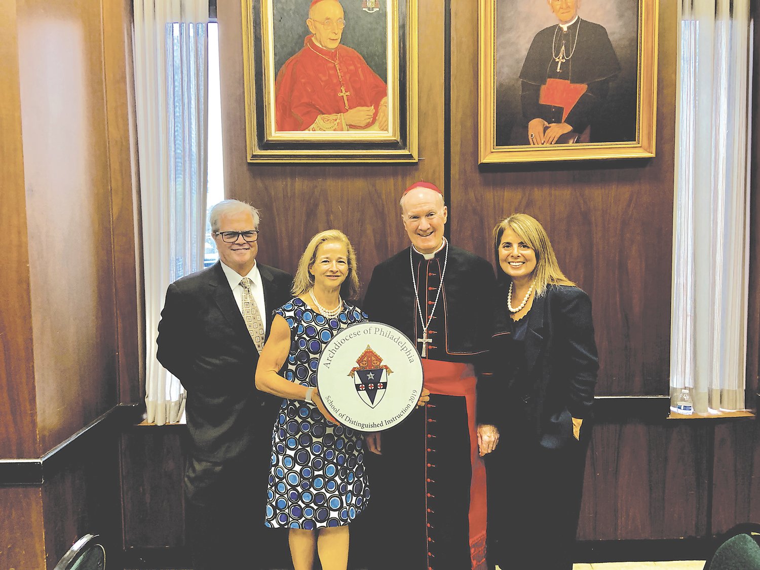 From left are: Dr. Andrew McLaughlin, secretary for elementary education; Dawn Parker, principal of Our Lady of Mount Carmel School; Auxiliary Bishop Michael Fitzgerald and Michelle Stetler, director of institutional advancement of Our Lady of Mount Carmel.