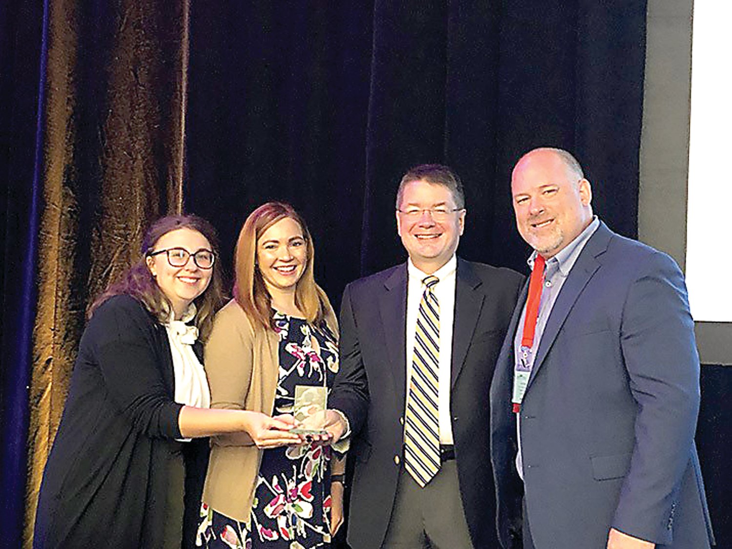 Representatives from Delaware Valley University accept the National Society for Experiential Education (NSEE) 2019 Outstanding Experiential Learning Program award. From left: Experience360 Advisor Emmaline Armstrong, Experience360 Program Director Darrah Mugrauer, Vice President for Academic Affairs Dr. Benjamin Rusiloski and President of the Board of Directors of NSEE Paul Kwant. Photograph by Delaware Valley University.