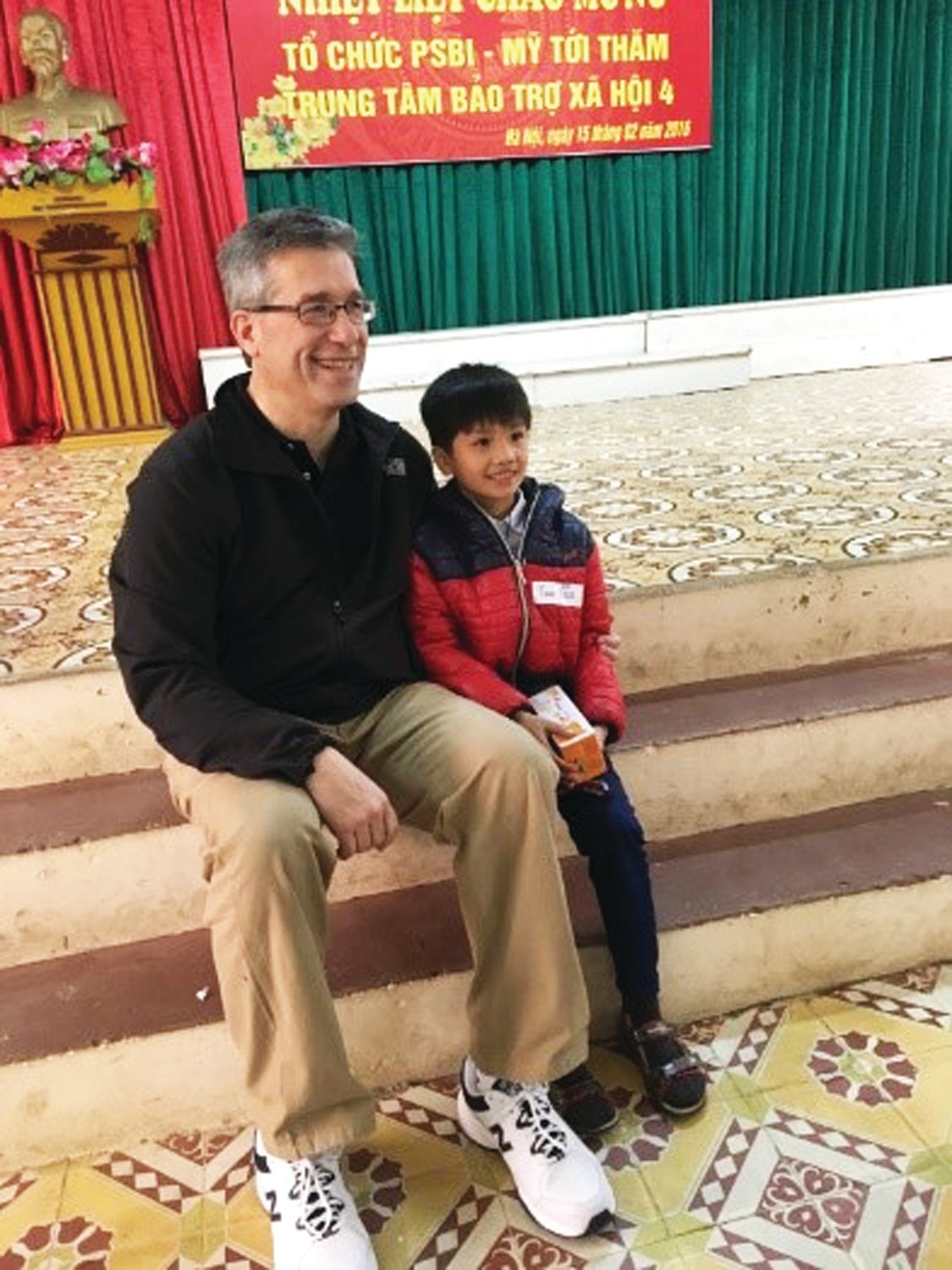 David Ballai chats with a Vietnamese boy during his visit to that country with Pearl S. Buck International.