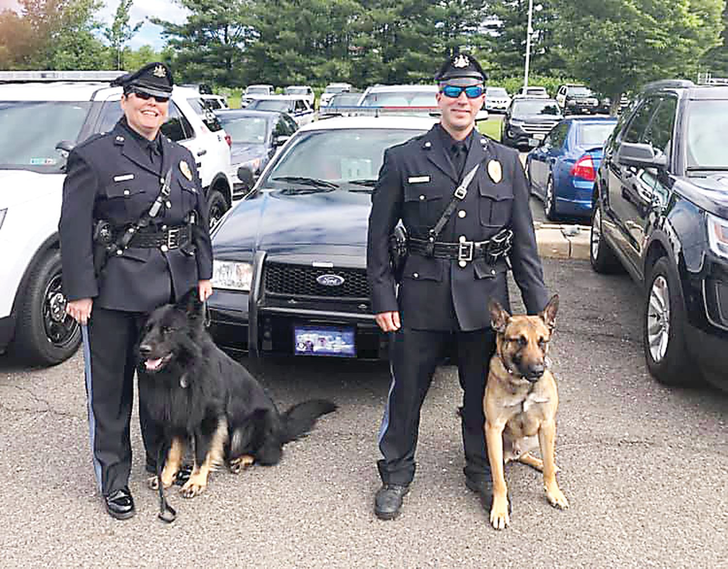 Middletown police officers Felt and Clawson with their K-9s.