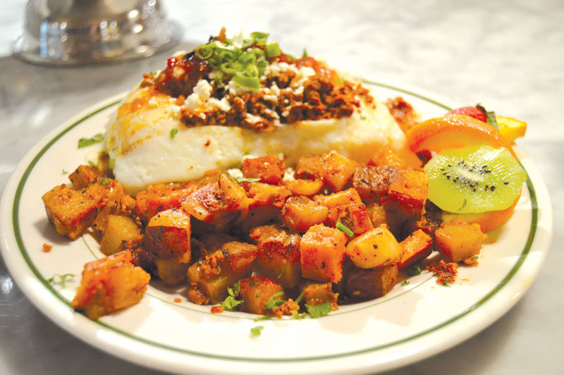 Eggs with grilled polenta, with pepper jam, chorizo sausage, tomatoes and feta, is a favorite dish at the Farm Café in Stockton, N.J.