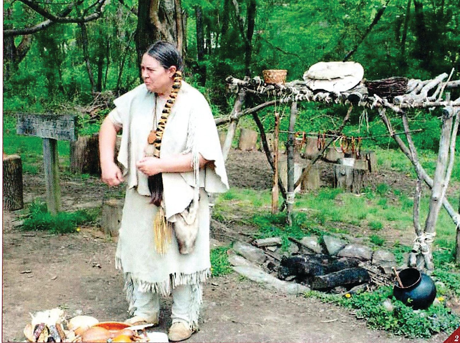 A volunteer talks about native cooking at the Lenape Village at the Churchville Nature Center. Photograph by Kathryn Finegan Clark.