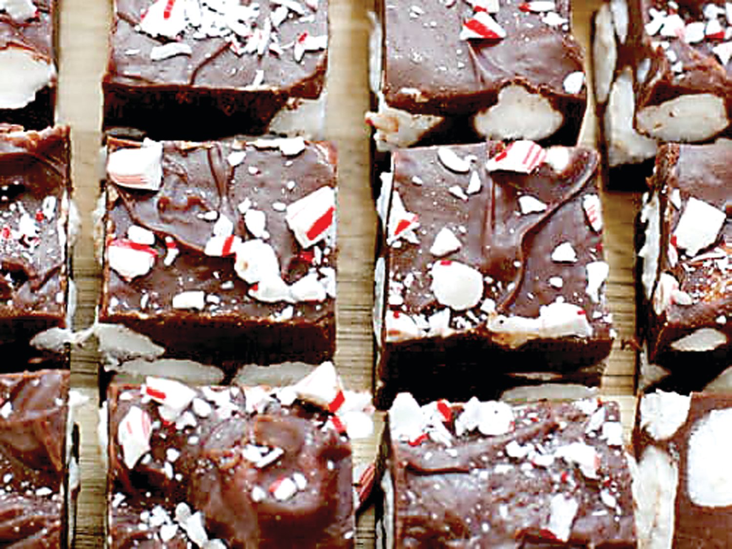 Chocolate fudge gets something extra with seasonal crushed candy canes and chopped up marshmallows in this easy recipe. Photograph by barefeetinthekitchen.com.