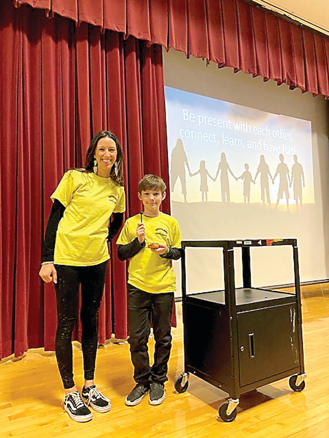 Groveland Elementary student support counselor Michelle Fuentes and fifth-grader Rowan Shaw, Mindfulness Master Club member present moment practices at the school’s Mindfulness Family Fun Night in January. Photograph by Rebecca Fink.