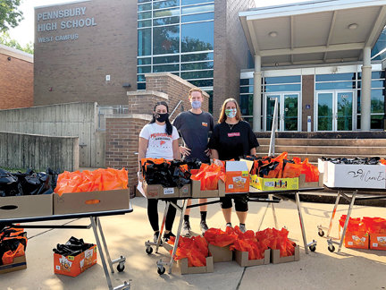 Faculty and staff members participate in a gift bag delivery for Pennsbury High School seniors.