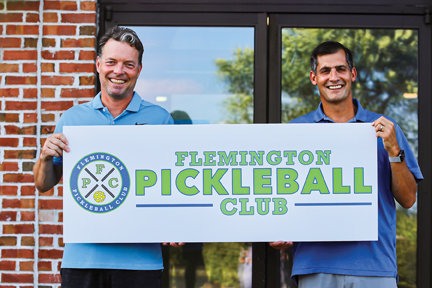 Business partners and lifelong friends, Bob Drinane, left, and Eric Luque, are pictured outside the home of Flemington Pickleball Club, slated to open in mid-September.