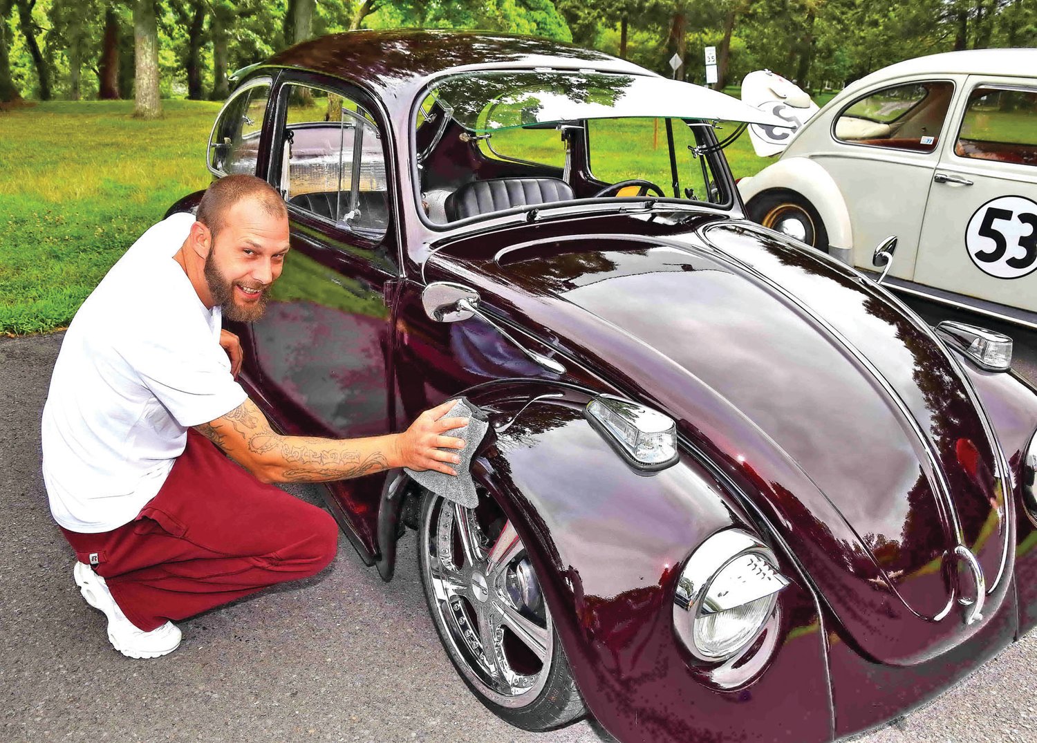 Raven Fritts with his restored 1974 VW Beetle.