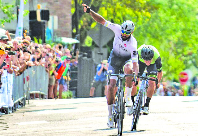 Frank Travieso, from Albany, Ga., edges past the finish line, finishing first in Men’s Bike Race.