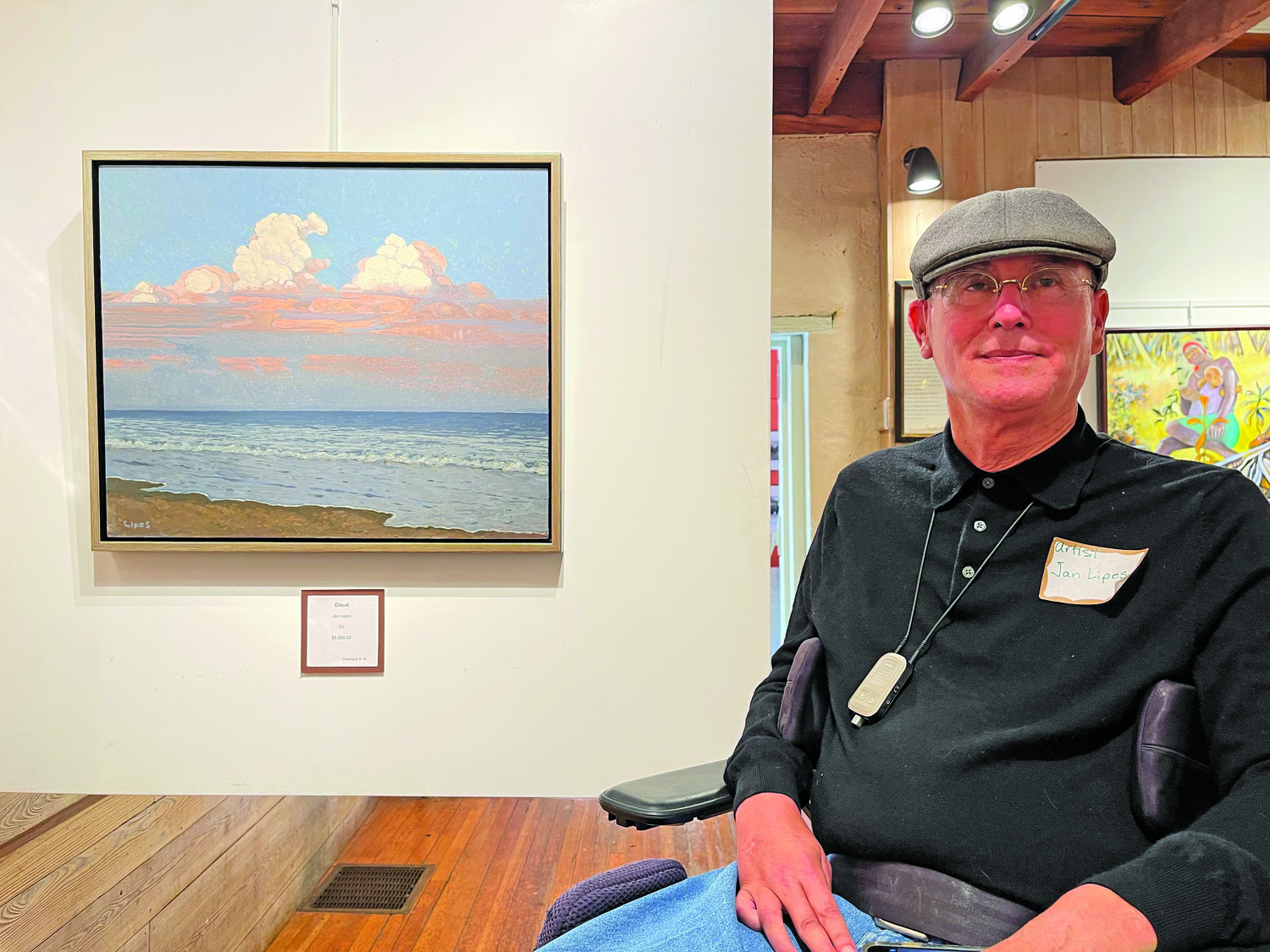 Jan Lipes of Doylestown in front of “Clouds,” his oil seascape. Lipes was also on hand last week to meet and greet visitors