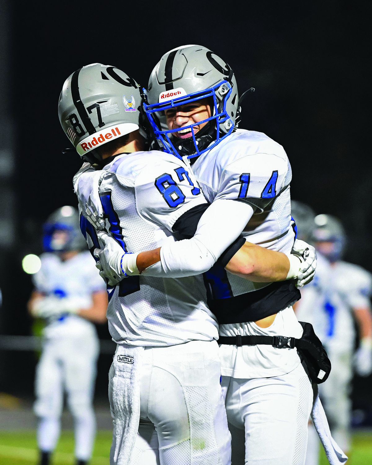 Quakertown’s Zach Fondl and Dylan Harrison embrace after the final whistle.