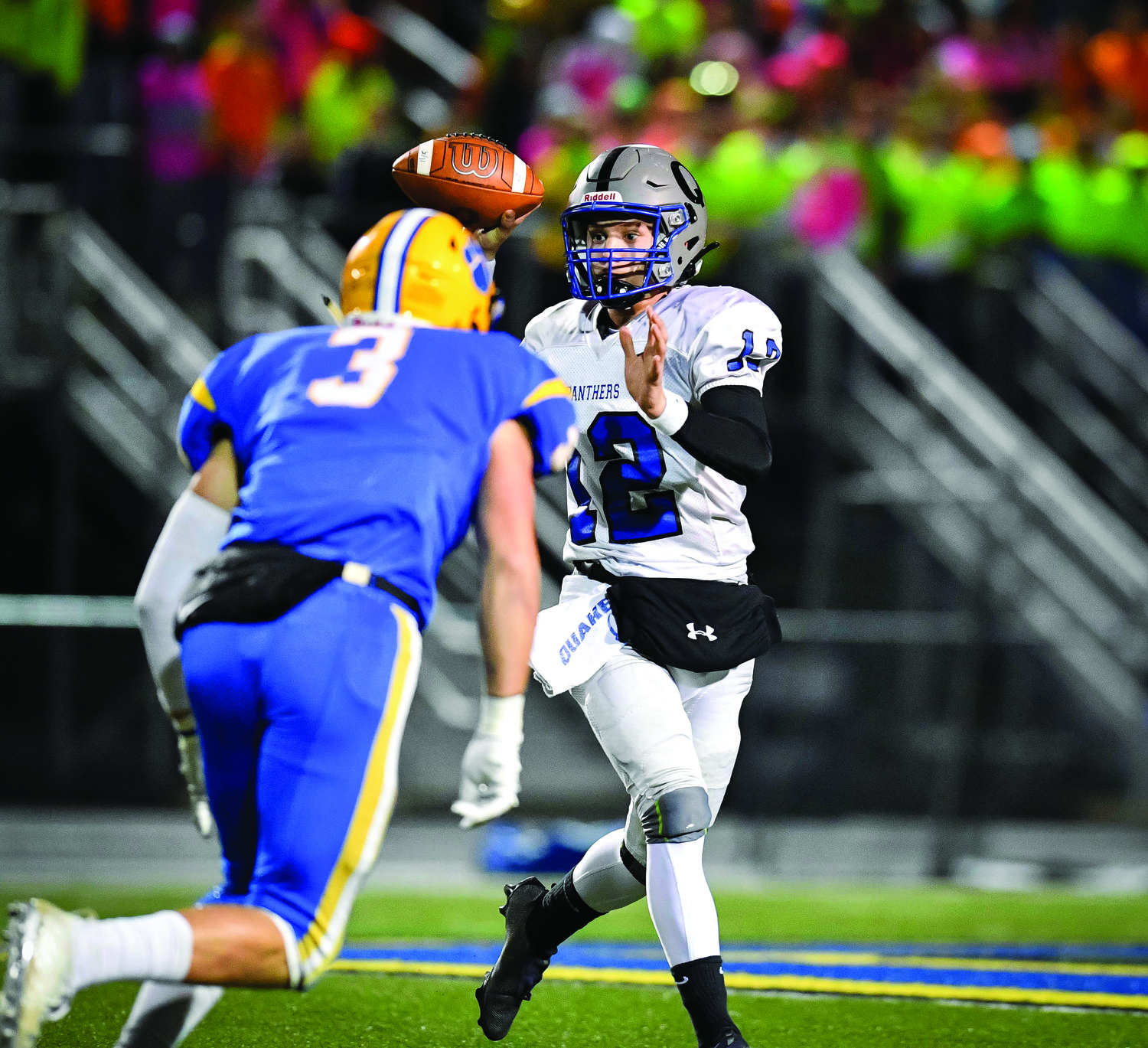 Quakertown’s Will Steich throws a short pass to Tyler Woodman for the second TD of the game.